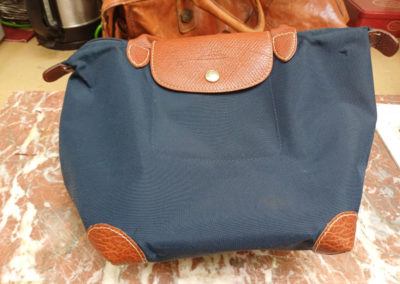 Protection d'un sac Longchamps par des coins